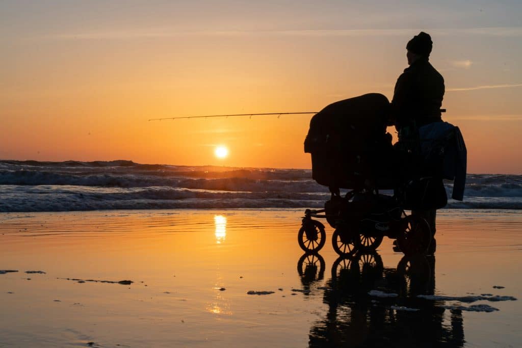 parent with child on the beach